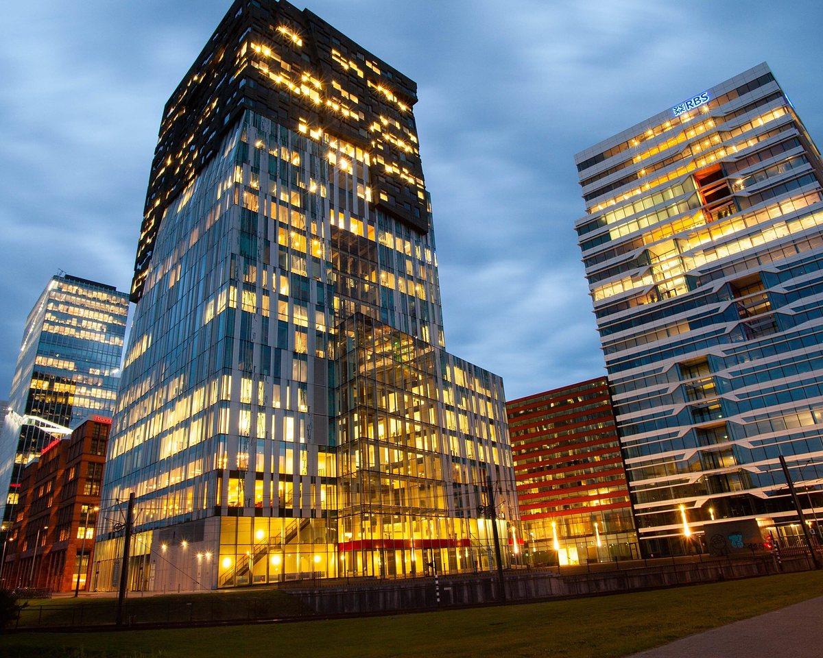 Financial district towers lit up at dusk